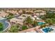 Aerial view featuring a backyard oasis with pool, spa, fire pit, and lush landscaping in a serene neighborhood at 8633 Kennedy Heights Ct, Las Vegas, NV 89131