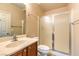 Cozy bathroom features a single sink vanity, frosted glass shower, and neutral color palette at 8633 Kennedy Heights Ct, Las Vegas, NV 89131