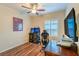Nice bedroom featuring game machines, a desk, and shuttered windows at 8633 Kennedy Heights Ct, Las Vegas, NV 89131