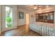 Serene bedroom with door to the garden, TV, and ceiling fan at 8633 Kennedy Heights Ct, Las Vegas, NV 89131