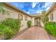 Inviting front entrance featuring desert landscaping, a tiled walkway, and mature greenery at 8633 Kennedy Heights Ct, Las Vegas, NV 89131