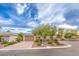 Charming single-story home featuring a desert landscaped yard, mature trees, and a welcoming front facade at 8633 Kennedy Heights Ct, Las Vegas, NV 89131