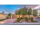 Charming single-story home featuring a desert landscaped yard, mature trees, and a welcoming front facade at 8633 Kennedy Heights Ct, Las Vegas, NV 89131