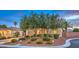 Attractive single-story home featuring mature landscaping, a two-car garage, and a well-maintained lawn at 8633 Kennedy Heights Ct, Las Vegas, NV 89131