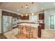 Well-lit kitchen featuring a center island with barstool seating and stainless steel appliances at 8633 Kennedy Heights Ct, Las Vegas, NV 89131