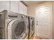 Laundry room with washer, dryer, and storage cabinets at 8633 Kennedy Heights Ct, Las Vegas, NV 89131