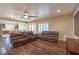 Inviting living room featuring hardwood floors, recessed lighting, and comfortable leather seating at 8633 Kennedy Heights Ct, Las Vegas, NV 89131