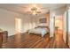 Comfortable main bedroom with a ceiling fan, hardwood floors, and plenty of space at 8633 Kennedy Heights Ct, Las Vegas, NV 89131
