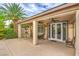 Covered patio features ceiling fans, plenty of seating, and gated access to the backyard at 8633 Kennedy Heights Ct, Las Vegas, NV 89131