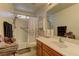 Bathroom with white sink and vanity and combination shower and tub with curtain at 9091 Jumping Jacks Ave, Las Vegas, NV 89178