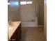 Bathroom featuring a combined tub and shower, and vanity with sink at 9091 Jumping Jacks Ave, Las Vegas, NV 89178