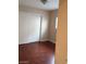 Bedroom with wood-look flooring, white walls, and sliding door closet at 9091 Jumping Jacks Ave, Las Vegas, NV 89178