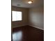 Bedroom with a window and wood-look flooring at 9091 Jumping Jacks Ave, Las Vegas, NV 89178