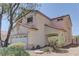 Charming two-story home featuring a two-car garage and low maintenance landscaping at 9091 Jumping Jacks Ave, Las Vegas, NV 89178