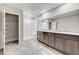 Modern bathroom featuring a double vanity, tiled floor and shower, and separate shelving, perfect for relaxation and comfort at 934 Twincrest Ave, North Las Vegas, NV 89032