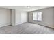 Bright bedroom features neutral walls, plush gray carpet, and a closet with sliding doors at 934 Twincrest Ave, North Las Vegas, NV 89032