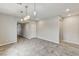 Dining area with tile floors, modern light fixtures, and neutral wall color at 934 Twincrest Ave, North Las Vegas, NV 89032