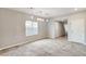 Bright dining room with tile flooring, contemporary light fixtures, and backyard view at 934 Twincrest Ave, North Las Vegas, NV 89032