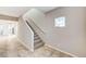 Hallway featuring ceramic tile flooring, and a carpeted staircase with natural light at 934 Twincrest Ave, North Las Vegas, NV 89032
