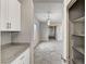 Hallway view with modern lighting, neutral colors, and convenient access to storage at 934 Twincrest Ave, North Las Vegas, NV 89032