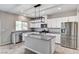 Kitchen showcasing stainless appliances, granite countertops, and a central island for meal prep and gathering at 934 Twincrest Ave, North Las Vegas, NV 89032