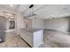 Kitchen features a central island and stainless-steel appliances, enhancing the property's appeal at 934 Twincrest Ave, North Las Vegas, NV 89032