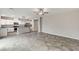Spacious living area featuring tile flooring and an open layout into the adjacent kitchen at 934 Twincrest Ave, North Las Vegas, NV 89032