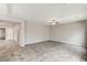 Spacious living area with tile floors, fan, and neutral walls, creating an open and airy feel at 934 Twincrest Ave, North Las Vegas, NV 89032
