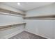 Well-organized walk-in closet with ample shelving and carpeting, providing plenty of room for storage and organization at 934 Twincrest Ave, North Las Vegas, NV 89032