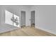 Spacious bedroom featuring wood-style floors, neutral walls, and an open closet at 10200 Wood Work Ln, Las Vegas, NV 89135