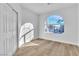 Bright bedroom featuring a closet and large arched window offering natural light at 10200 Wood Work Ln, Las Vegas, NV 89135