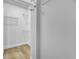 Organized walk-in closet featuring wooden floors and metal shelving at 10200 Wood Work Ln, Las Vegas, NV 89135