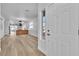 Modern entryway showcasing an open floor plan and white front door at 10200 Wood Work Ln, Las Vegas, NV 89135