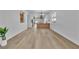 Bright, open-concept living area featuring sleek floors and modern finishes at 10200 Wood Work Ln, Las Vegas, NV 89135