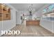 Bright living room featuring a wine rack, open floorplan, and modern chandelier at 10200 Wood Work Ln, Las Vegas, NV 89135