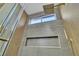 Contemporary shower with a rainfall shower head, built-in niche, and glass panel at 10200 Wood Work Ln, Las Vegas, NV 89135