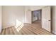 Bright bedroom features new wood-look flooring and entry doors at 10205 Birch Bluff Ln, Las Vegas, NV 89145