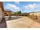 Large stamped concrete patio surrounded by mature landscaping offers privacy at 10302 Artful Stone Ave, Las Vegas, NV 89149