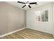 Inviting bedroom with natural light and modern ceiling fan at 10302 Artful Stone Ave, Las Vegas, NV 89149