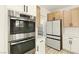 Modern kitchen featuring stainless steel appliances and custom cabinetry at 10302 Artful Stone Ave, Las Vegas, NV 89149