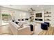 Bright living room boasts fireplace feature, open floor plan, and modern finishes at 10302 Artful Stone Ave, Las Vegas, NV 89149
