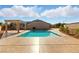 Beautiful backyard pool with an integrated hot tub, surrounded by a spacious patio area at 10302 Artful Stone Ave, Las Vegas, NV 89149