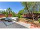 Private backyard patio with comfortable seating and lush landscaping at 10368 Mystic Pine Rd, Las Vegas, NV 89135