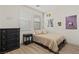 Cozy bedroom with neutral walls, wood floors, and ample natural light at 10368 Mystic Pine Rd, Las Vegas, NV 89135