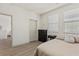 Comfortable bedroom with neutral walls, wood floors, and ample natural light at 10368 Mystic Pine Rd, Las Vegas, NV 89135