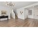 Inviting entryway features hardwood floors, staircase, neutral walls, and modern lighting at 10368 Mystic Pine Rd, Las Vegas, NV 89135