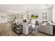 Open floor plan with living room, dining area, and fireplace, with natural light and modern decor at 10368 Mystic Pine Rd, Las Vegas, NV 89135