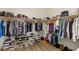 Large walk-in closet with ample storage and organized clothing racks at 10368 Mystic Pine Rd, Las Vegas, NV 89135