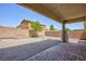 Open backyard space with a quaint tree feature and brick fire pit area, plus a covered patio with brickwork at 1037 Water Cove St, Henderson, NV 89011