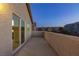 A spacious stucco balcony with neighborhood views and sliding glass doors at 1037 Water Cove St, Henderson, NV 89011